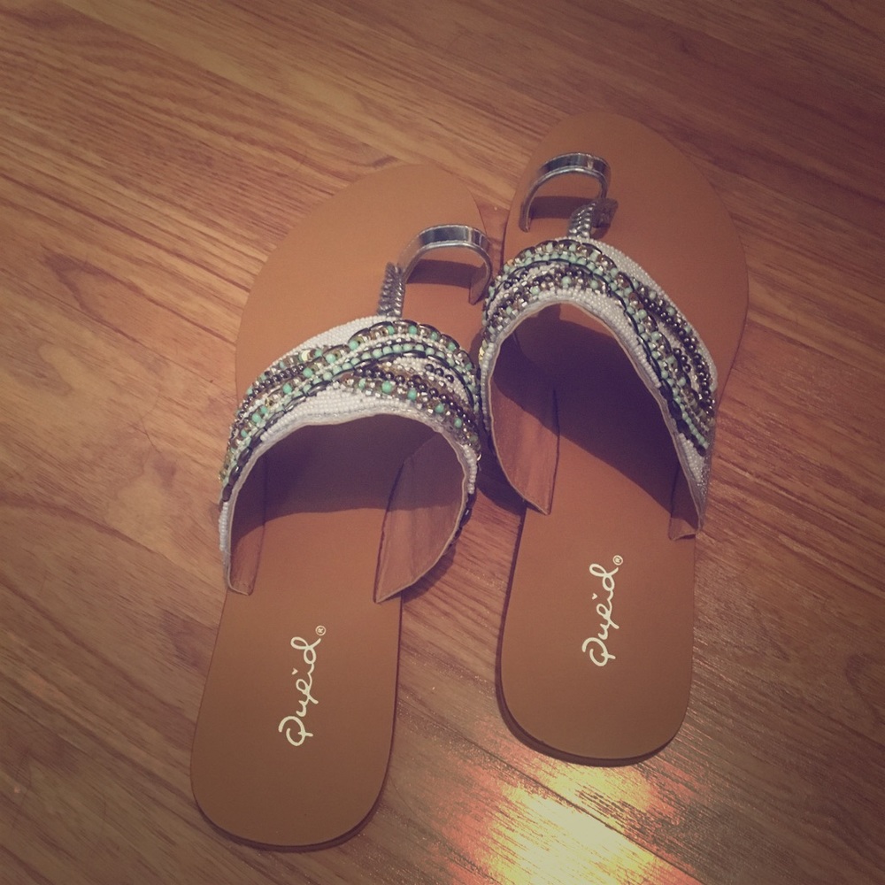 Green and cream beaded flip flops